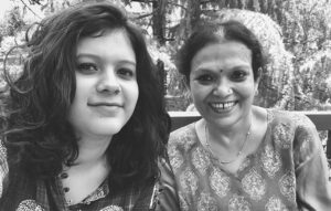 black and white image of mother and daughter smiling