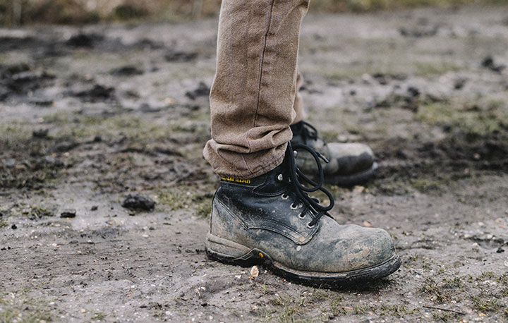 dirty black work boots