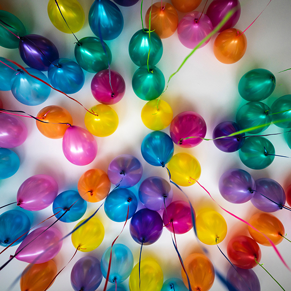 colorful balloons on a white ceiling