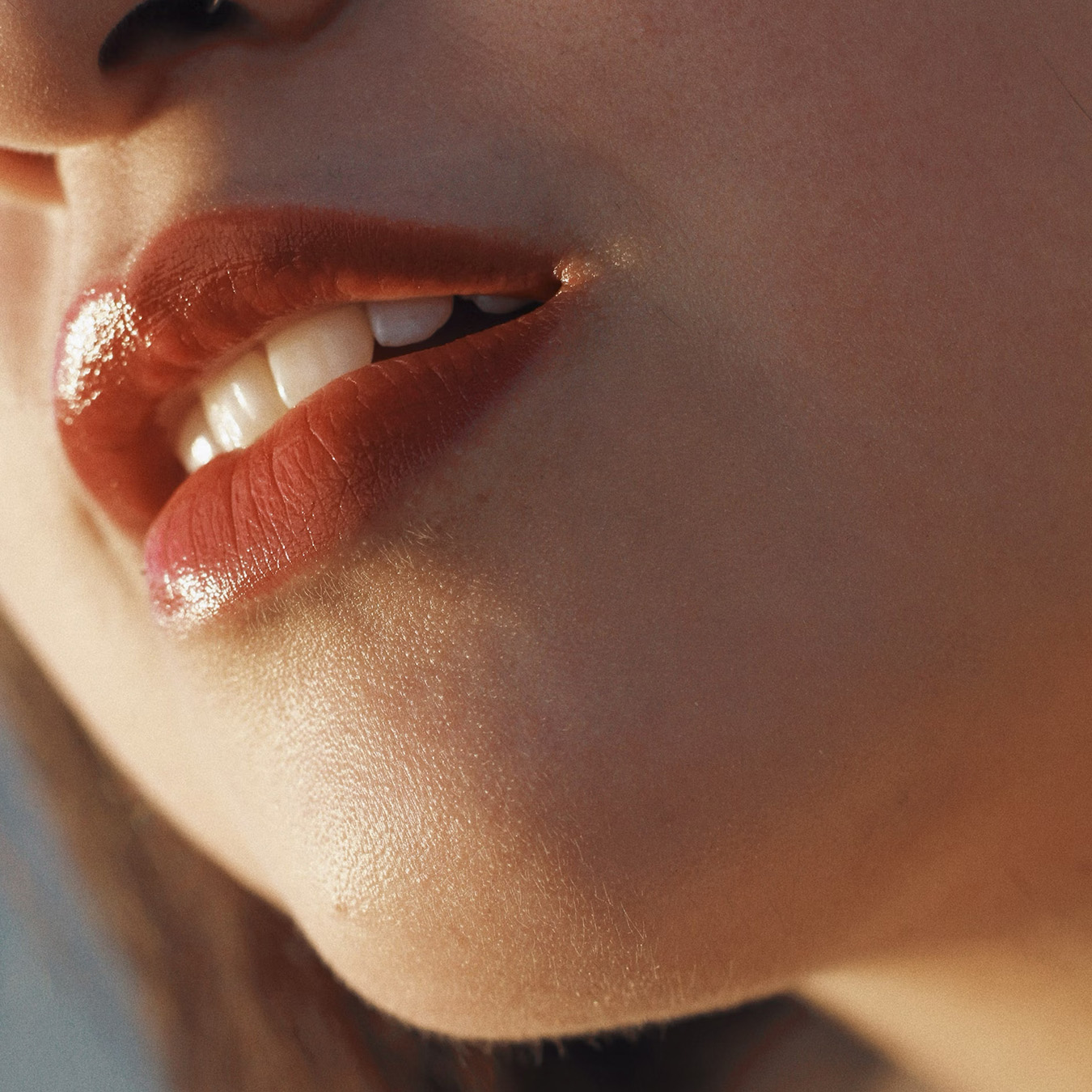 Close-up of a Woman’s Painted Red Lips and Half Smile